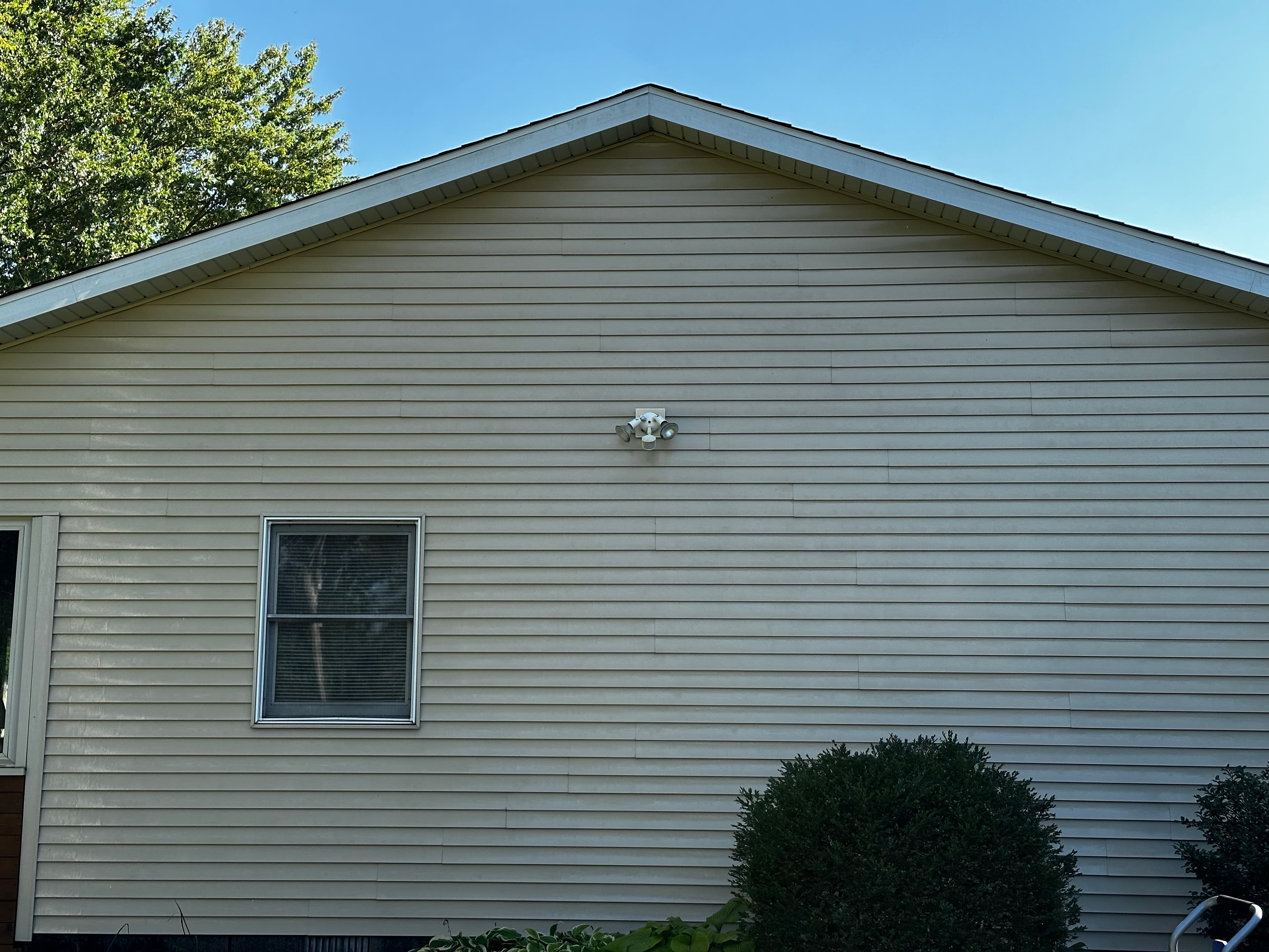 Clean vinyl siding after house washing in Crown Point, showcasing a pristine exterior finish.