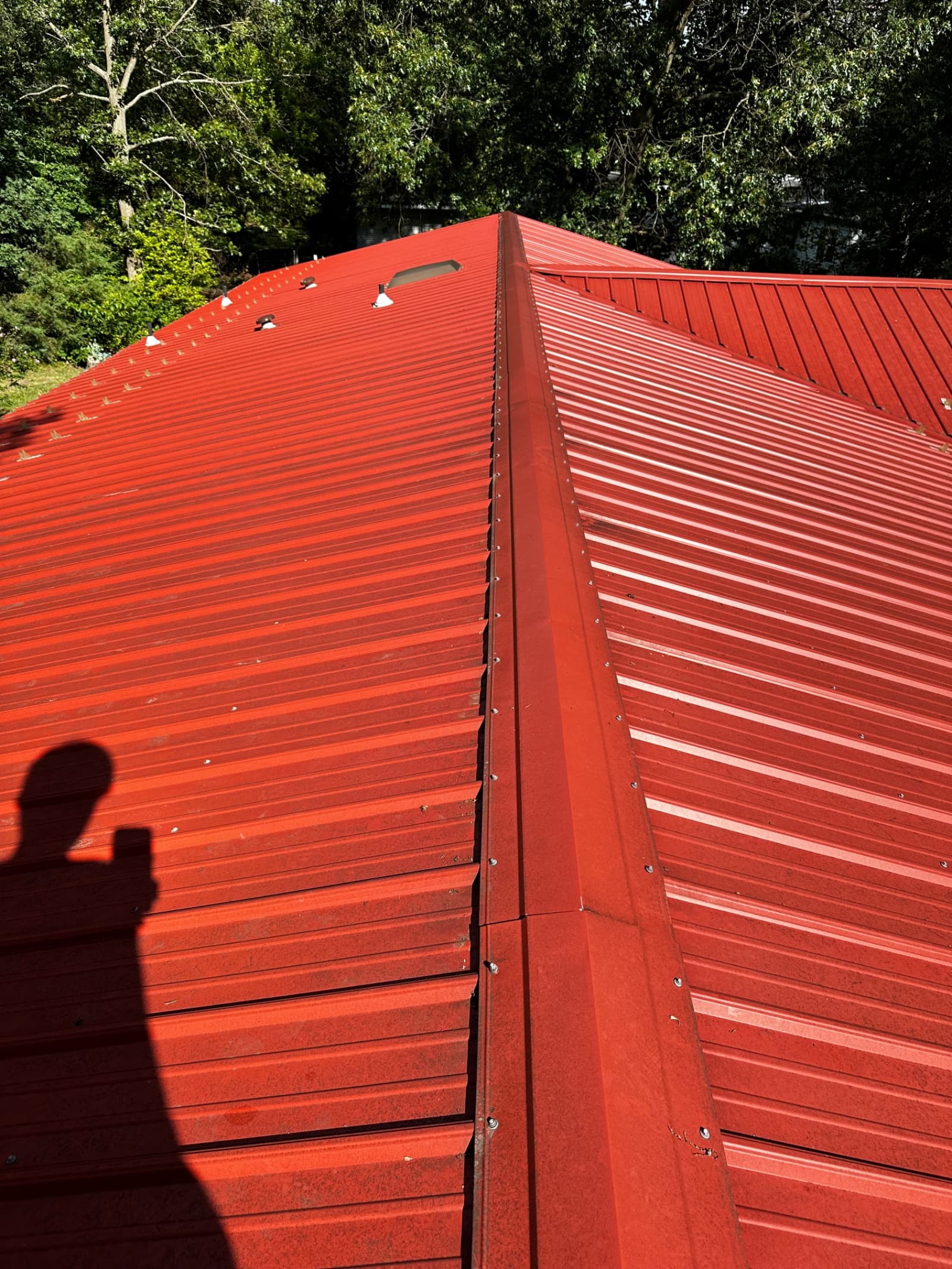 Clean red metal roof after pressure washing in Lowell, Indiana
