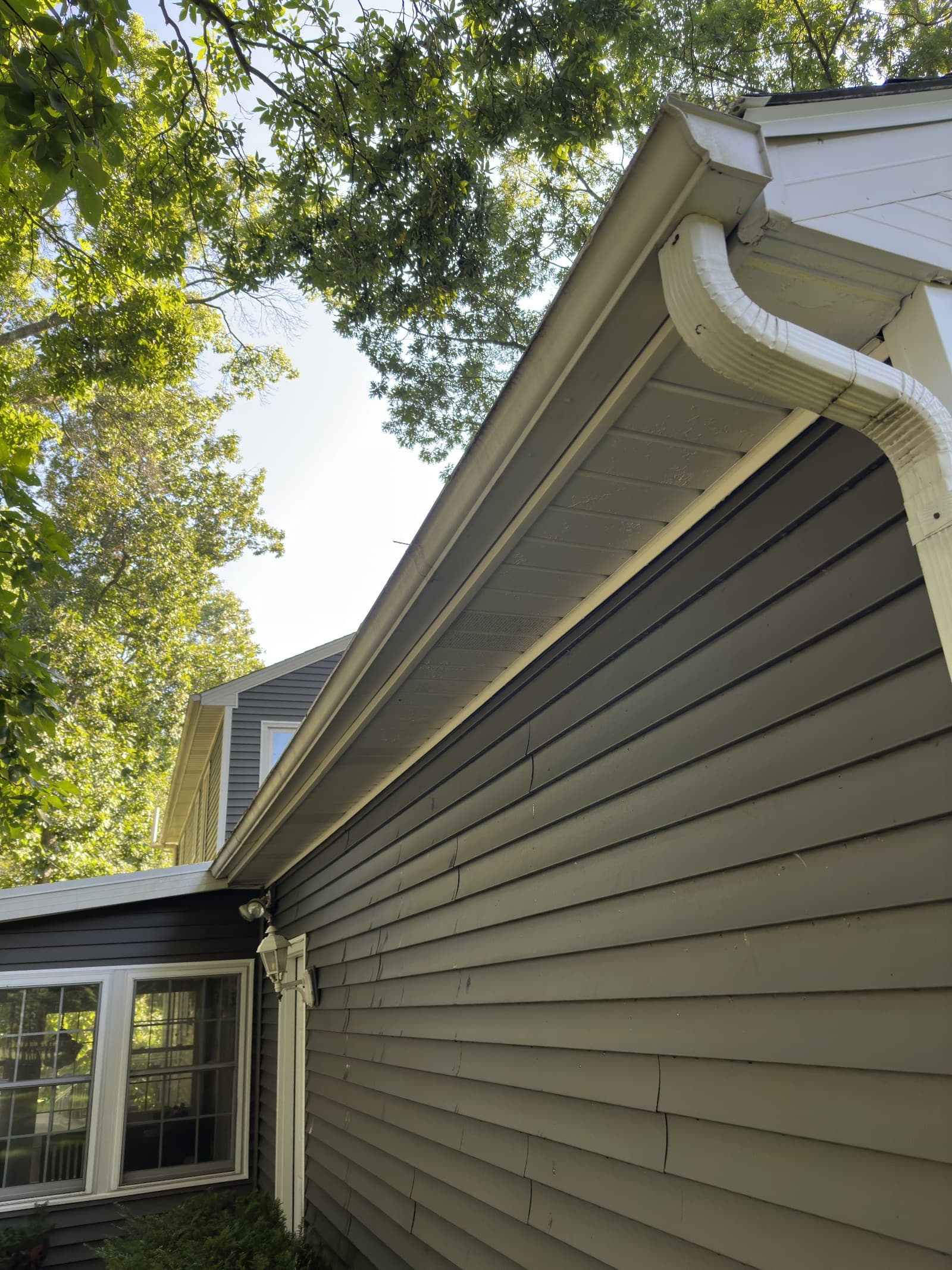 Clean vinyl siding and gutters on house in Demotte, Indiana