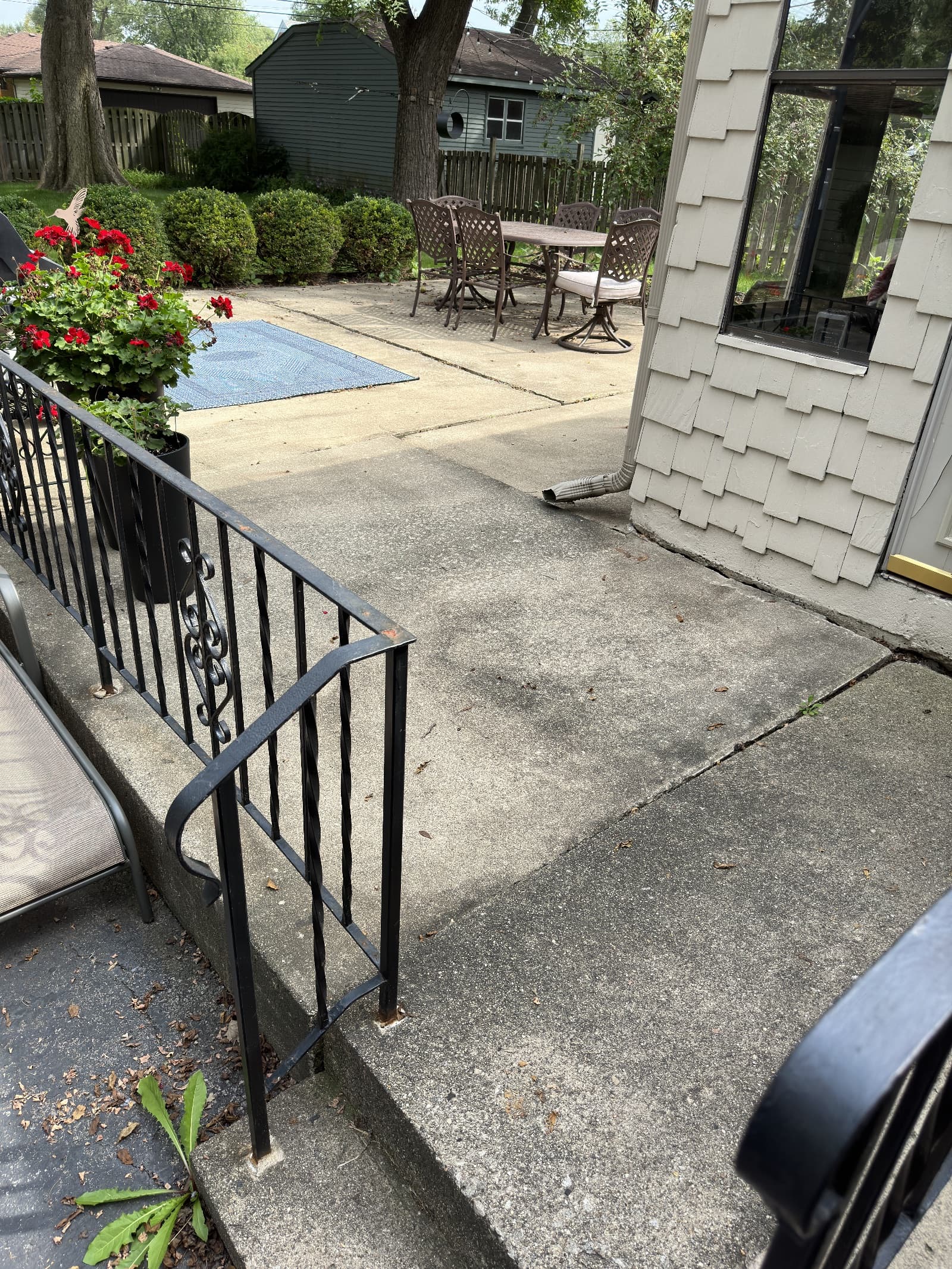 Concrete patio with mild staining before cleaning in Crown Point, Indiana.
