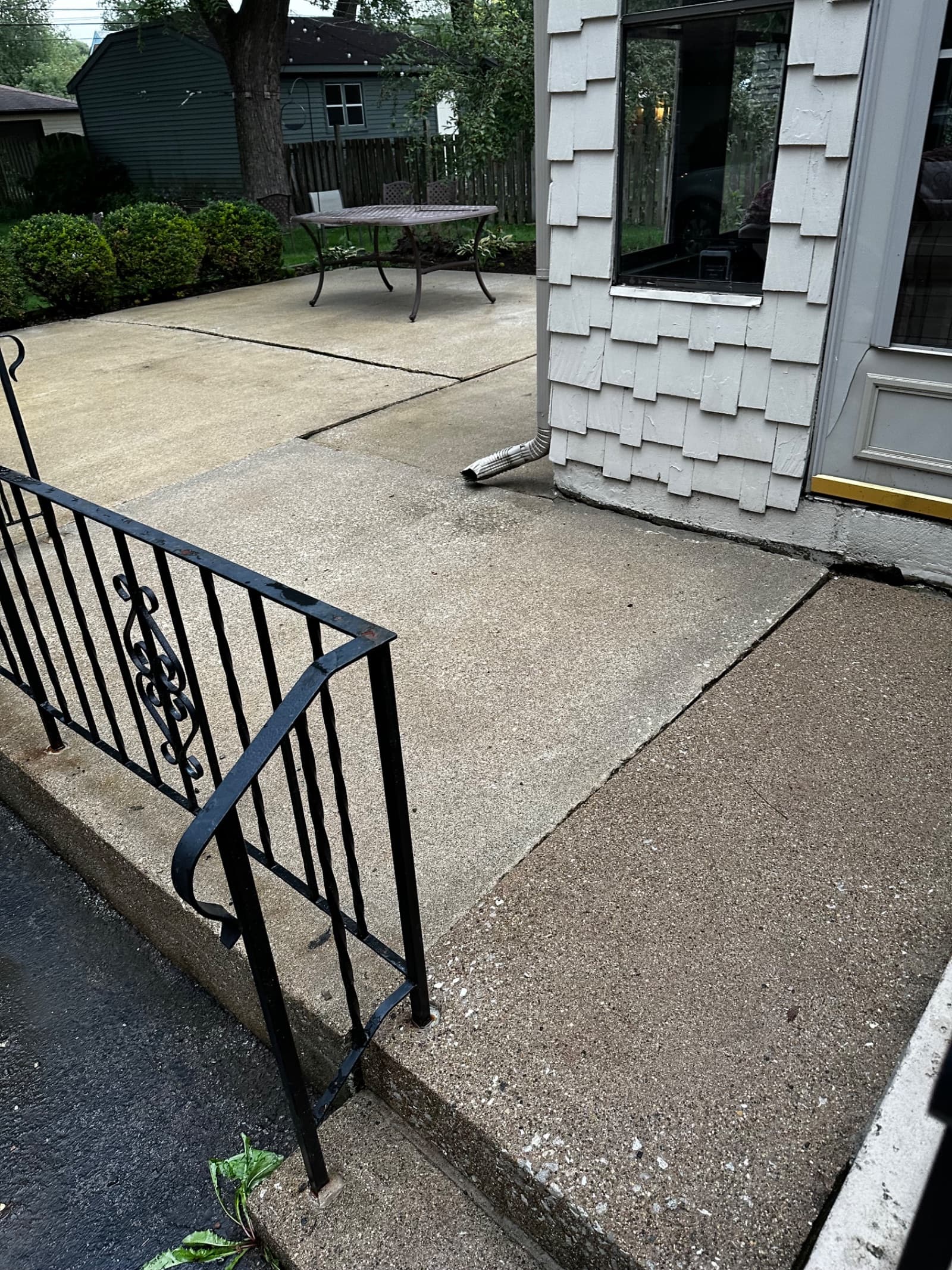Clean concrete patio and walkway next to house in Crown Point, Indiana
