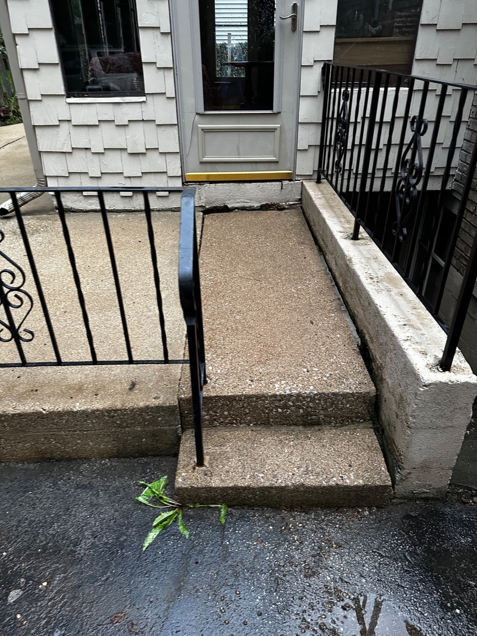 Clean concrete walkway and steps with railing in Crown Point, Indiana