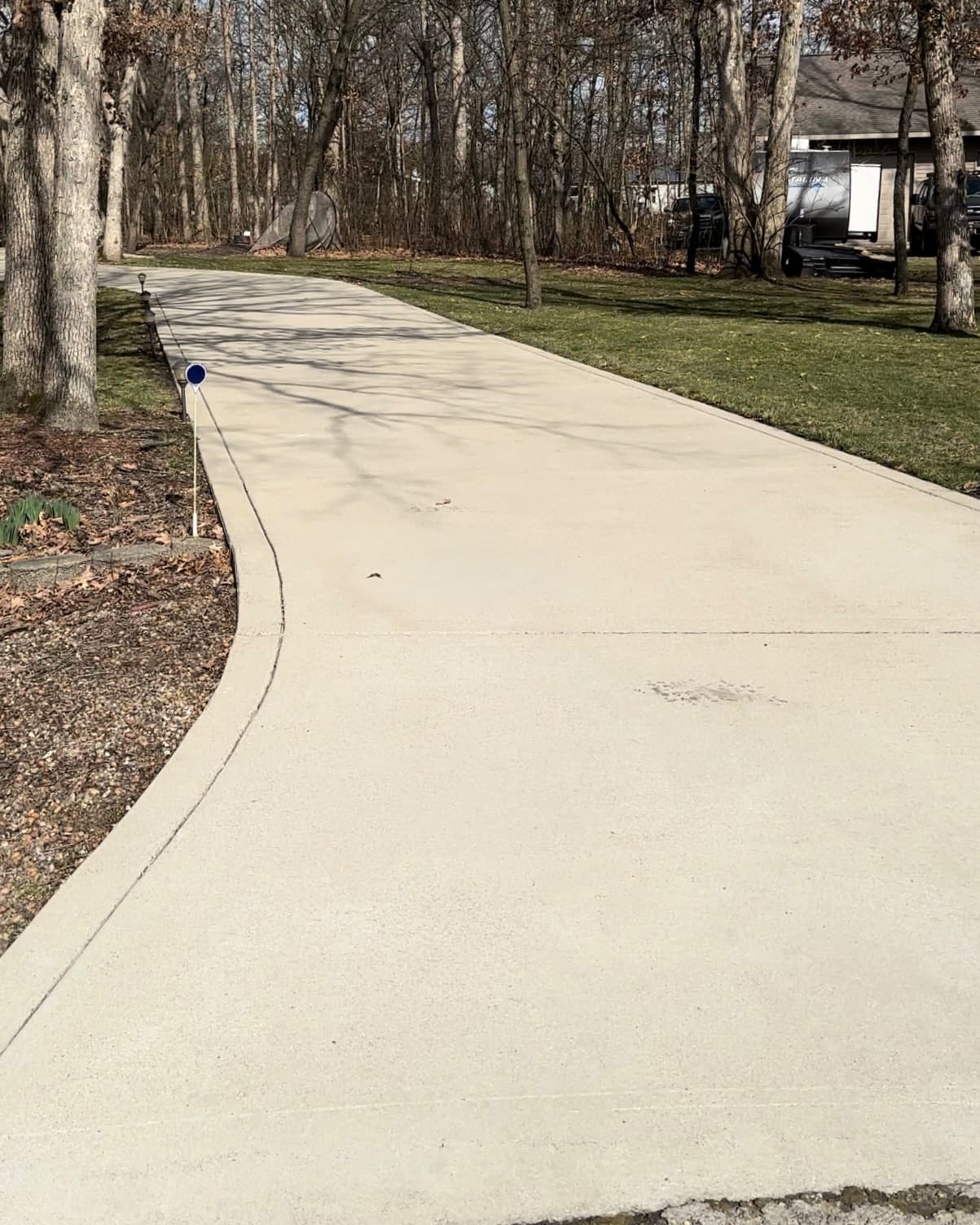 Clean concrete driveway in Demotte, Indiana after pressure washing