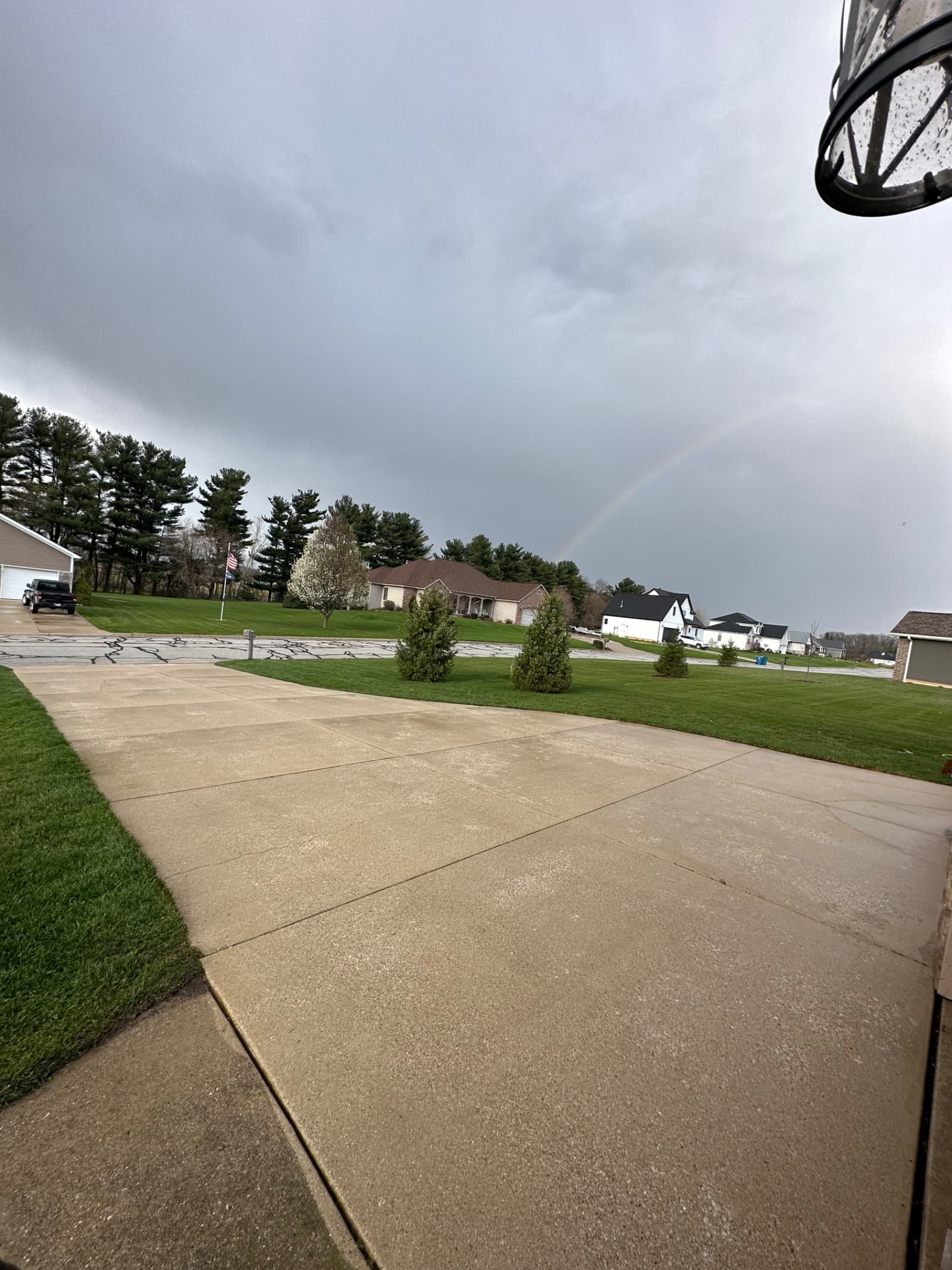 Clean concrete driveway with a light rain in Crown Point, Indiana