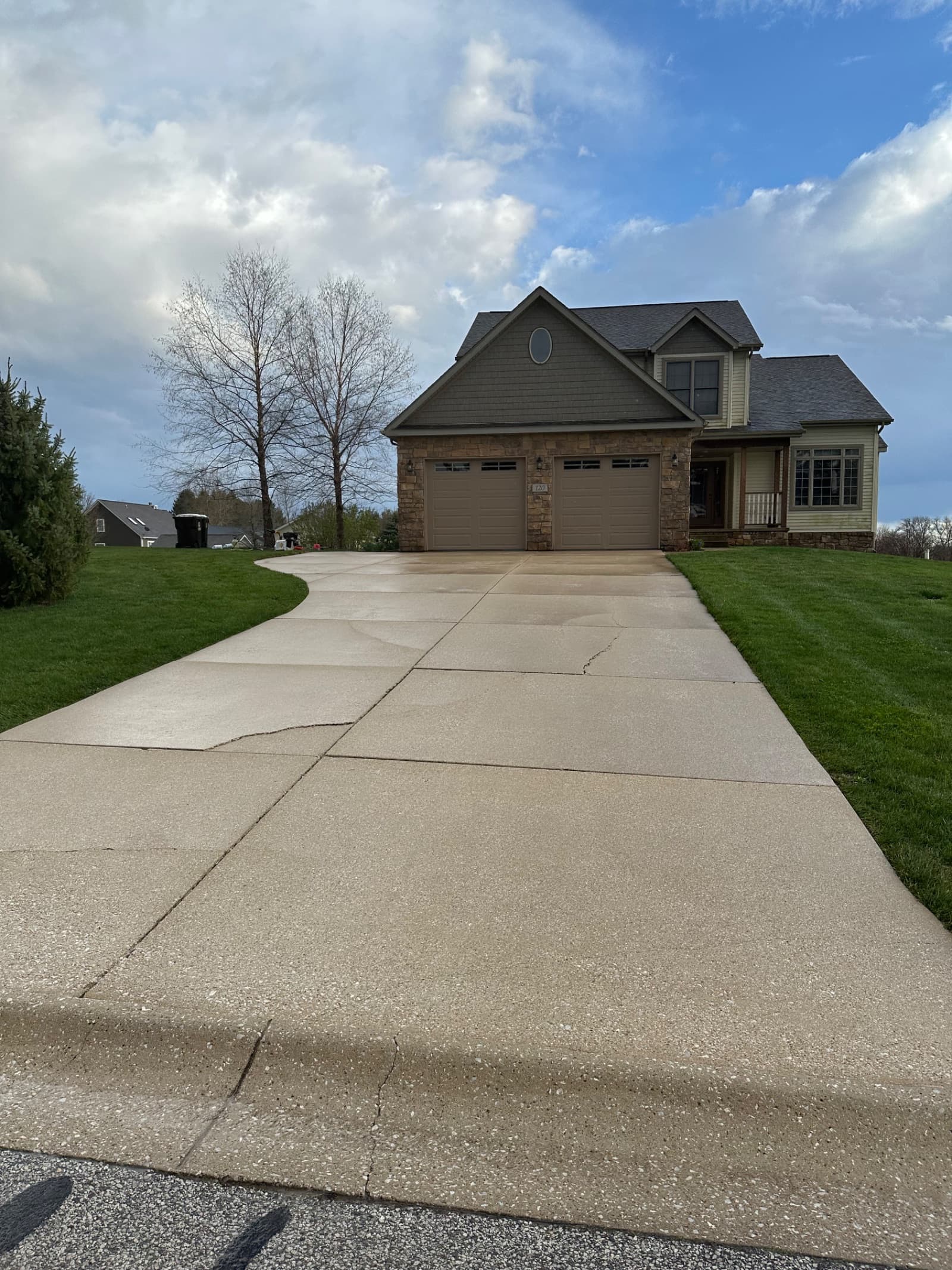 Clean concrete driveway in front of a house, Crown Point, Indiana.